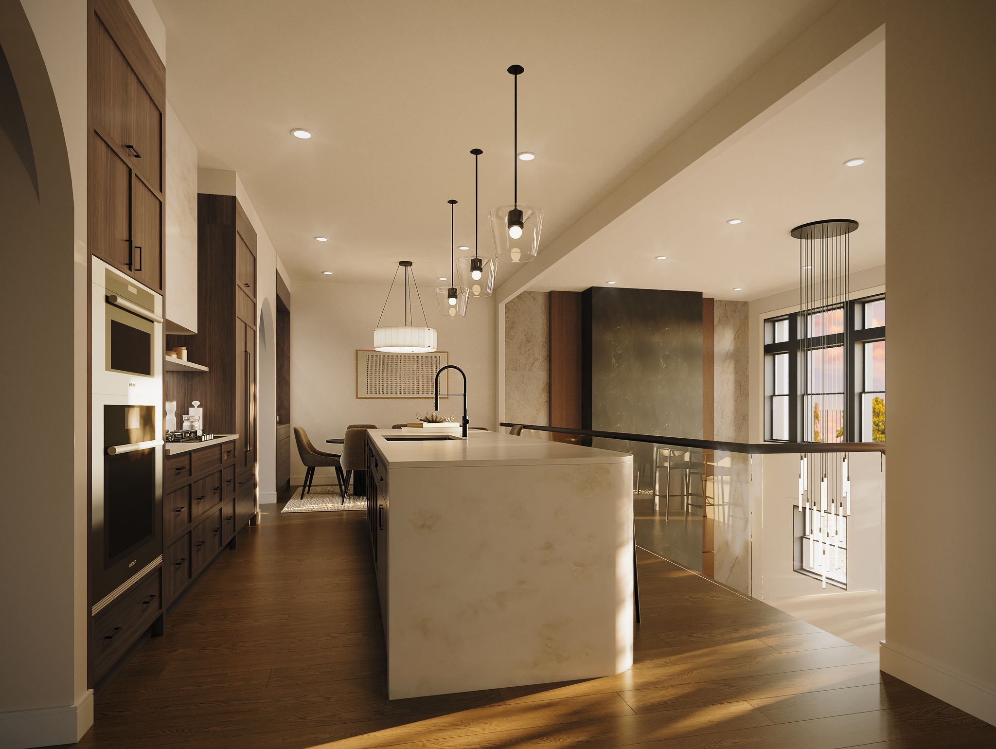 A modern open-concept kitchen with a large island and pendant lights overlooks a lower-level living area with tall windows.