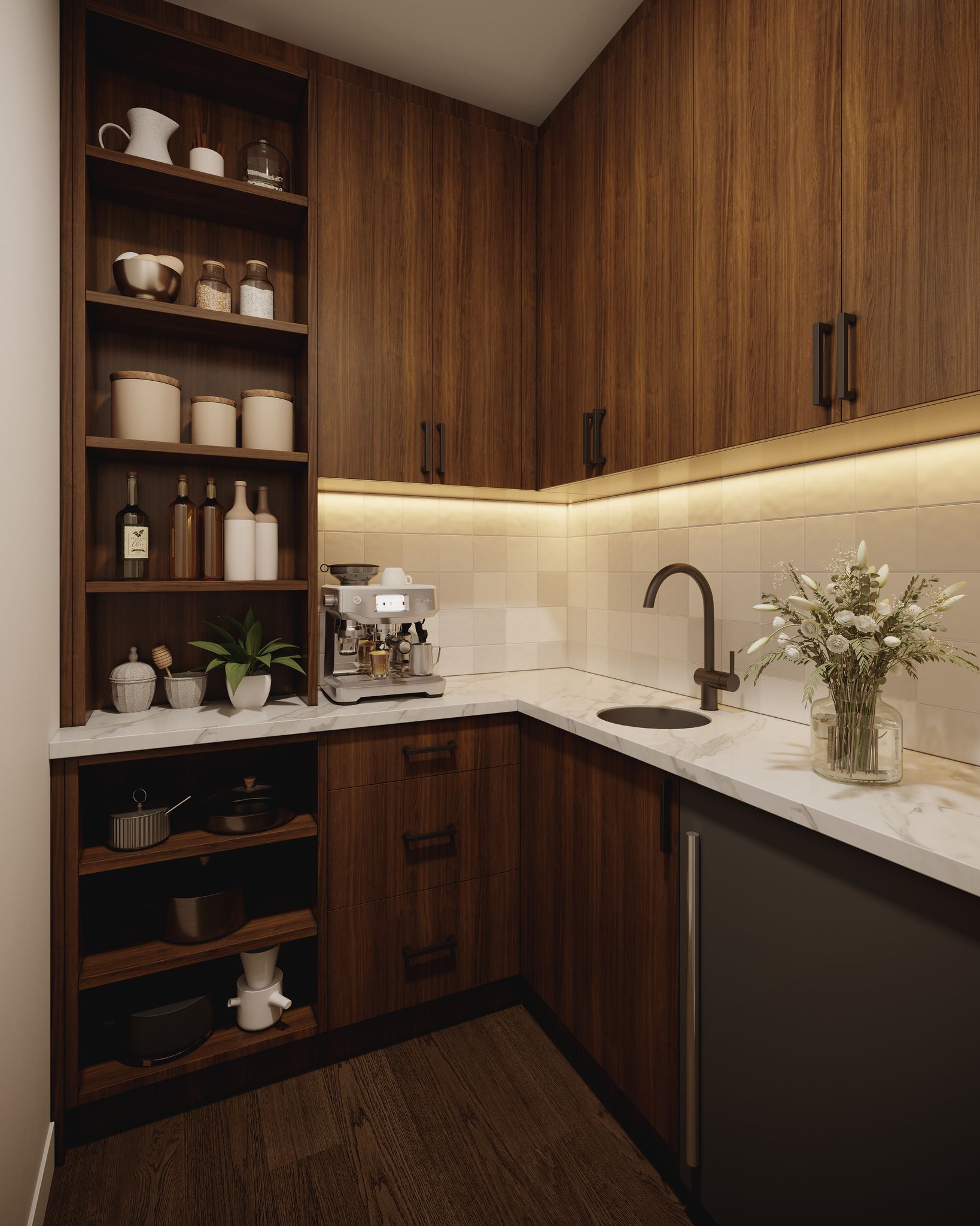 A modern pantry or coffee bar area features dark wood cabinets, open shelving, an espresso machine, a sink, and marble countertops.