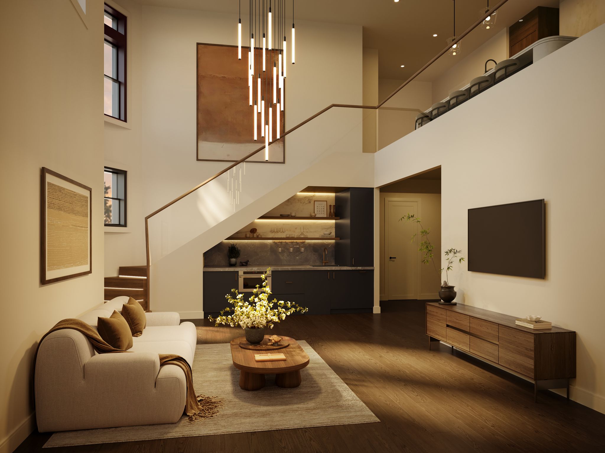 A modern living room with a white sofa, a coffee table, a staircase leading to a loft, and a built-in bar underneath the stairs.