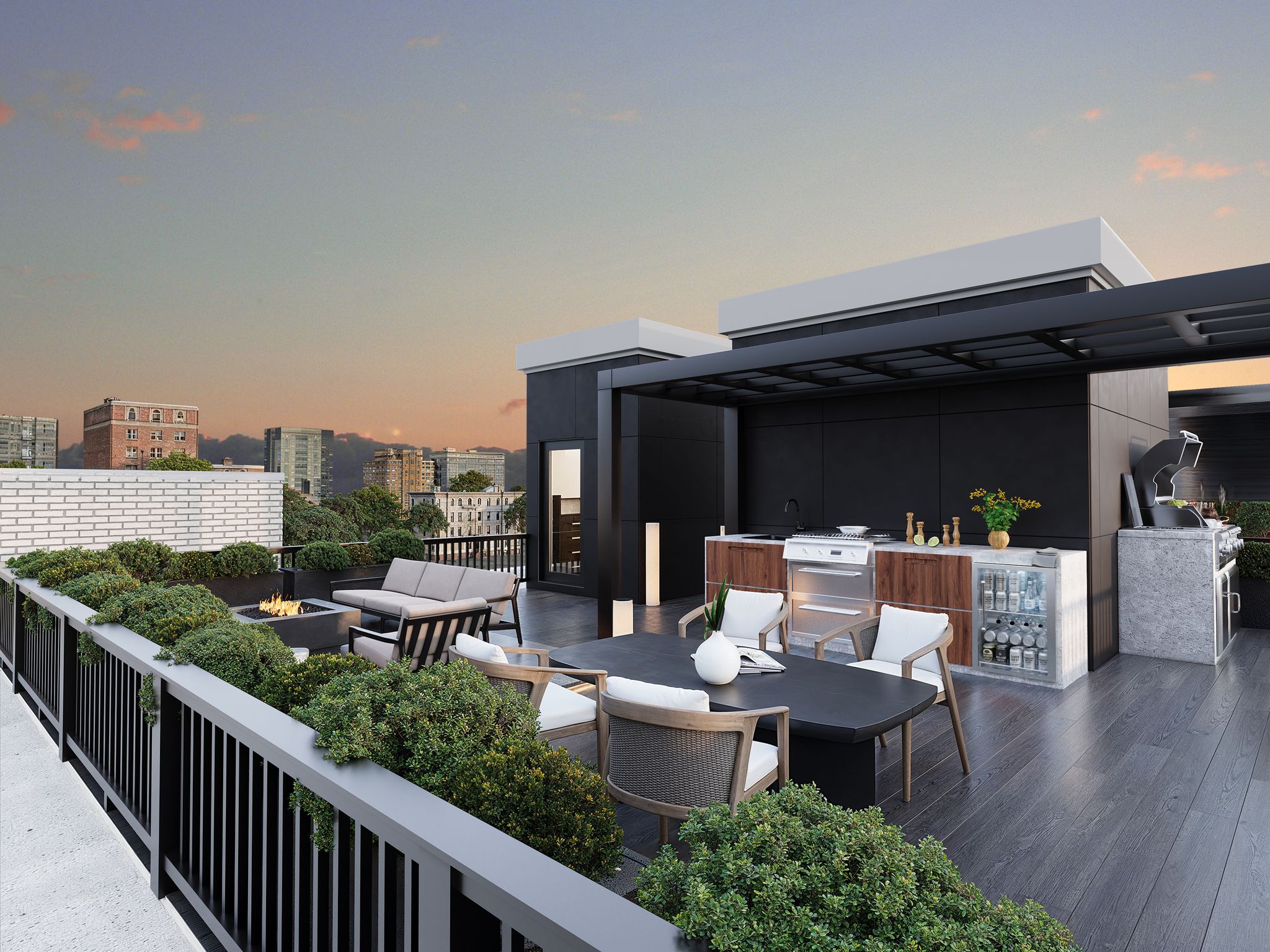 A modern rooftop deck features an outdoor kitchen, a dining area, a lounge with a fire pit, and city views at dusk.